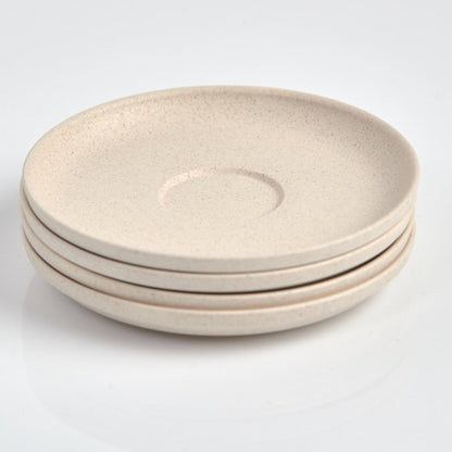 Pack of 4 Huskee small 3oz espresso saucers featuring the signature vertical ribbed design made from sustainable coffee husk waste top view in natural.