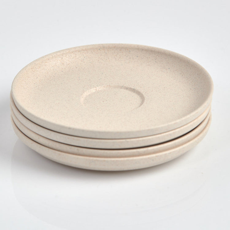 Pack of 4 Huskee small 3oz espresso saucers featuring the signature vertical ribbed design made from sustainable coffee husk waste top view in natural.
