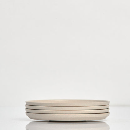 Pack of 4 universal Huskee Classic coffee saucers made from sustainable coffee husk waste in natural.