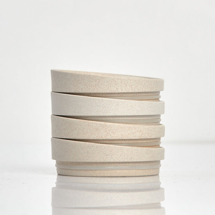 Pack of 4 universal Huskee reusable coffee cup lids made from sustainable organic coffee husk waste in natural.