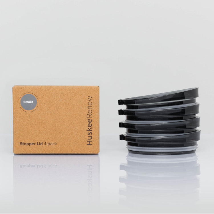 4 pack universal Huskee stopper lid featuring a spill-proof reusable design with integrated silicone seal in smoke with box.
