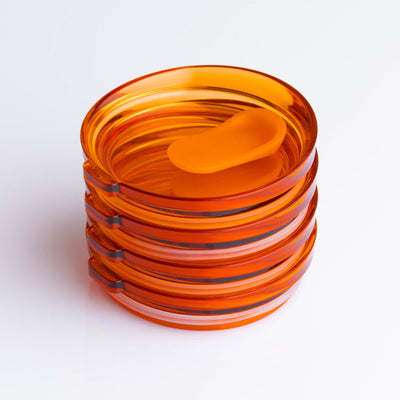 4 pack universal Huskee stopper lid featuring a spill-proof reusable design with integrated silicone seal in amber.