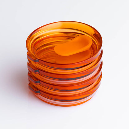 4 pack universal Huskee stopper lid featuring a spill-proof reusable design with integrated silicone seal in amber.