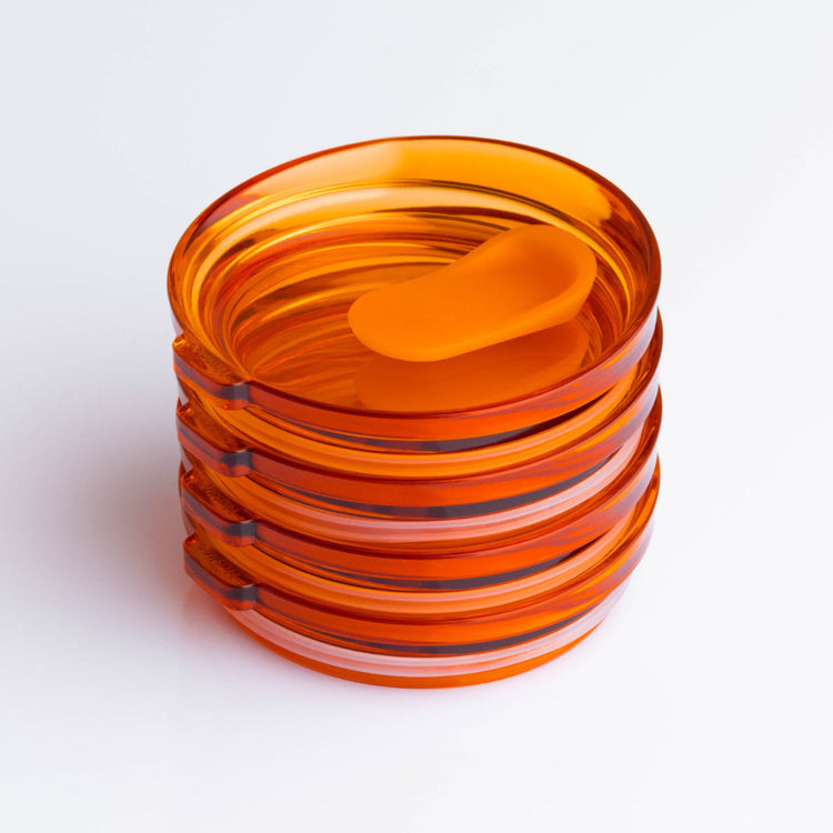 4 pack universal Huskee stopper lid featuring a spill-proof reusable design with integrated silicone seal in amber.