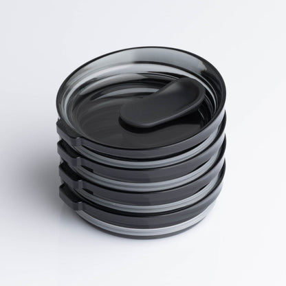 4 pack universal Huskee stopper lid featuring a spill-proof reusable design with integrated silicone seal in smoke.