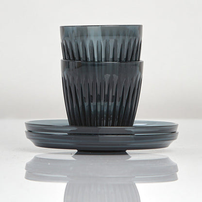 Complete HuskeeRenew 3oz espresso set of two cups and two matching saucers crafted from premium translucent recycled polymer in smoke.
