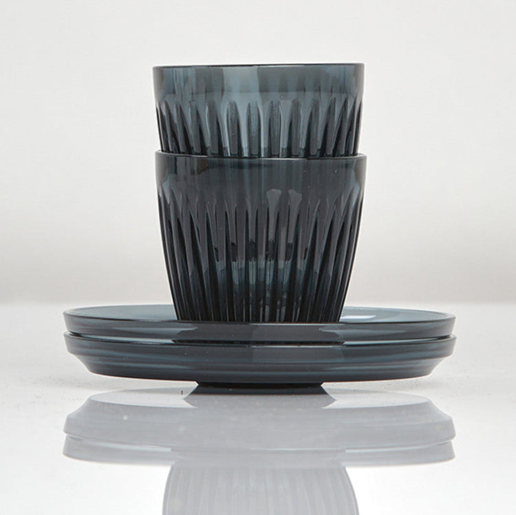 Complete HuskeeRenew 3oz espresso set of two cups and two matching saucers crafted from premium translucent recycled polymer in smoke.