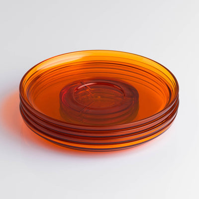 Pack of 4 translucent HuskeeRenew classic coffee saucers made from high-quality recycled polymers in amber.
