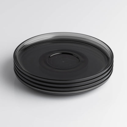 Pack of 4 translucent HuskeeRenew classic coffee saucers made from high-quality recycled polymers in smoke.