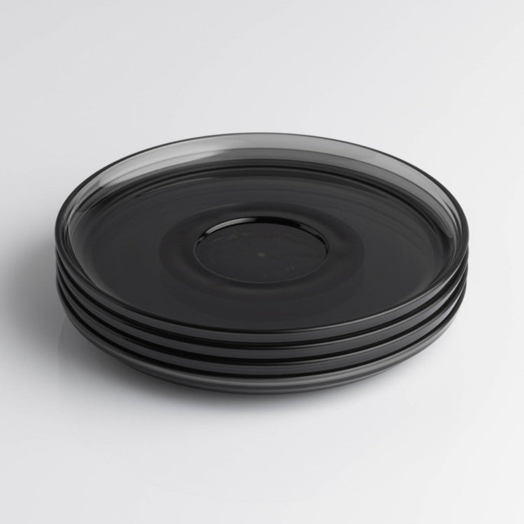 Pack of 4 translucent HuskeeRenew classic coffee saucers made from high-quality recycled polymers in smoke.