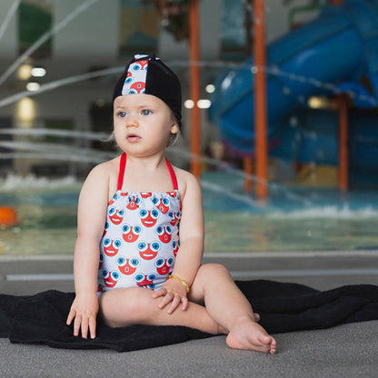 Baby wearing the Tyoub H2O water print halterneck one piece swimsuit at an Australian pool.