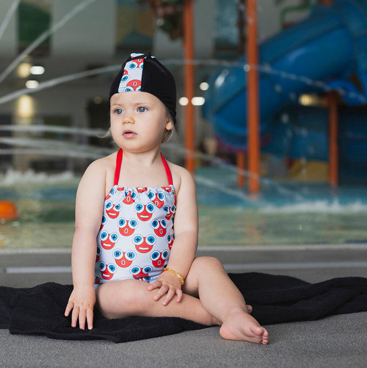 Baby wearing the Tyoub H2O water print halterneck one piece swimsuit at an Australian pool.