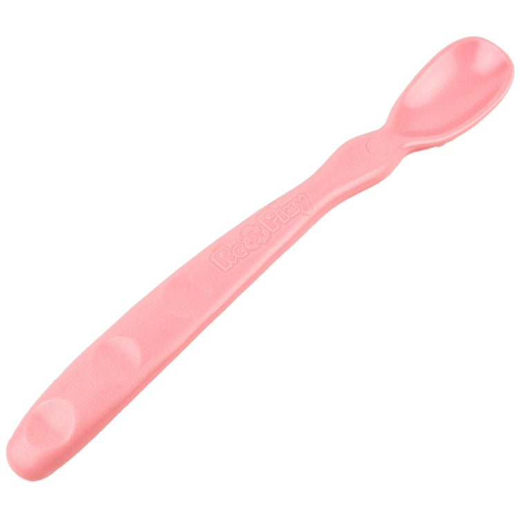 Close up view of the smooth rounded contour edges and gentle deep scoop depth on a non toxic infant weaning spoon in  Baby Pink.