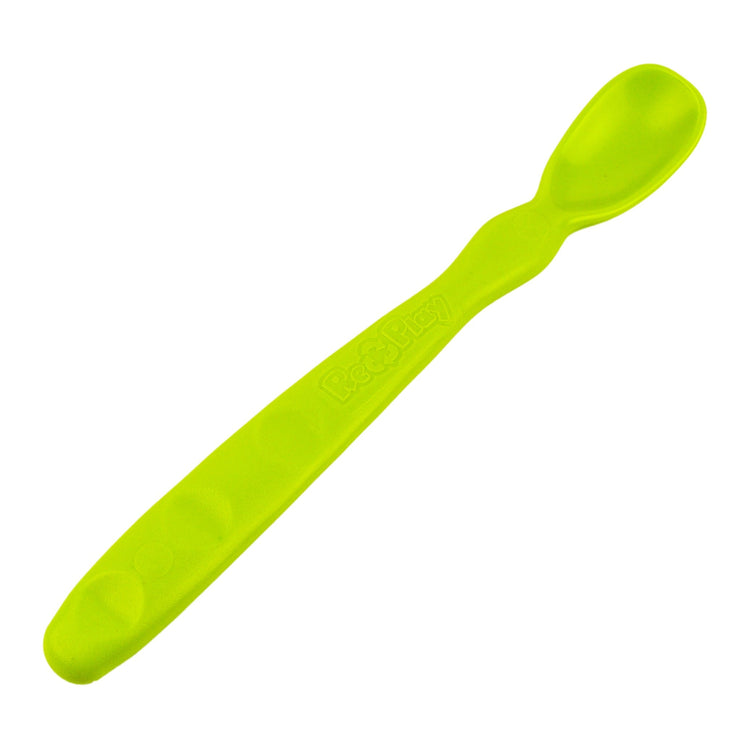 Close up view of the smooth rounded contour edges and gentle deep scoop depth on a non toxic infant weaning spoon in green.