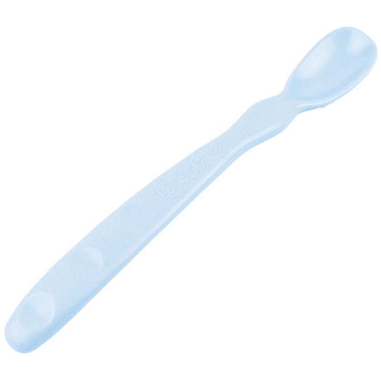 Close up view of the smooth rounded contour edges and gentle deep scoop depth on a non toxic infant weaning spoon in ice blue.