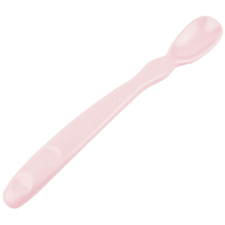Close up view of the smooth rounded contour edges and gentle deep scoop depth on a non toxic infant weaning spoon in Ice Pink.