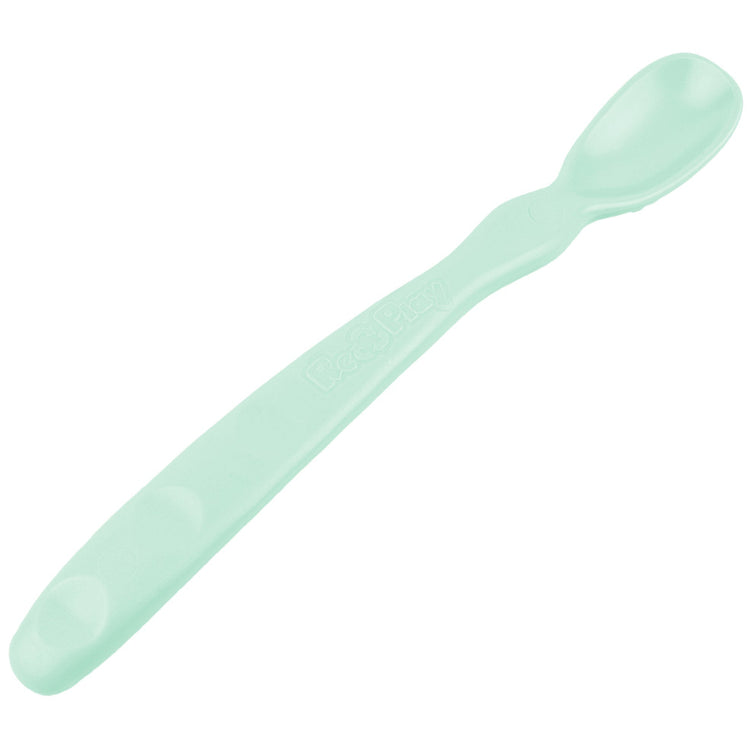 Close up view of the smooth rounded contour edges and gentle deep scoop depth on a non toxic infant weaning spoon mint.