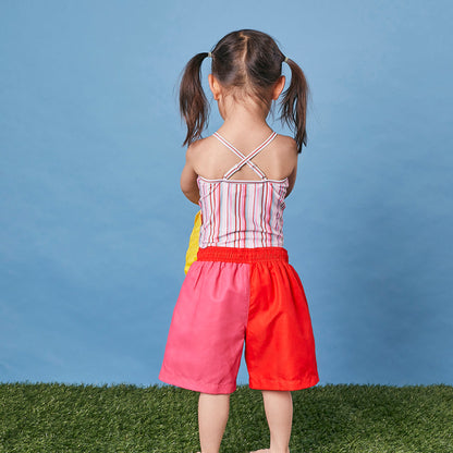 Child wearing Tyoub quick dry board shorts for Sun Smart UPF 50+ UV protectionback view.