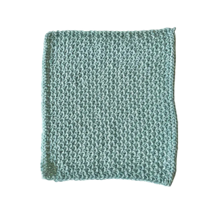Light blue handmade knitted dishcloth made from absorbent recycled cotton for kitchen and bathroom use.