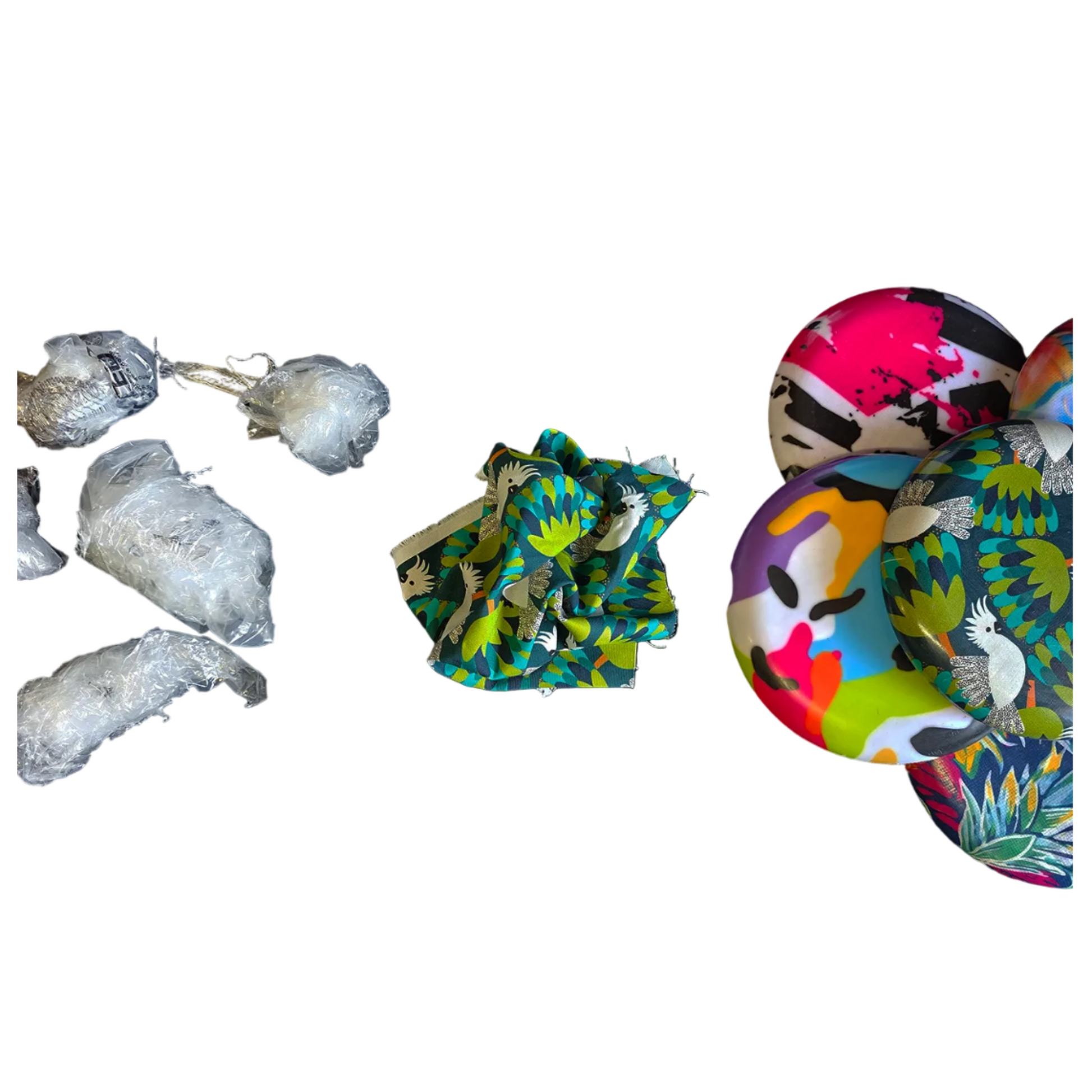 Standalone 230mm flying disc made from recycled Fijian beach waste showing vibrant, one-of-a-kind upcycled colour patterns showing the waste material used to construct the final product.