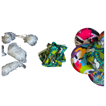 Standalone 230mm flying disc made from recycled Fijian beach waste showing vibrant, one-of-a-kind upcycled colour patterns showing the waste material used to construct the final product.