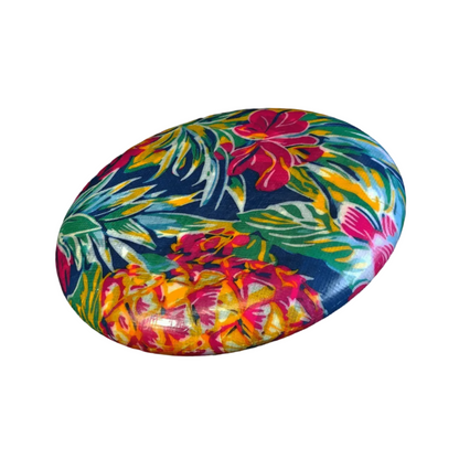 Standalone 230mm flying disc made from recycled Fijian beach waste showing vibrant, one-of-a-kind upcycled colour patterns in floral 2.