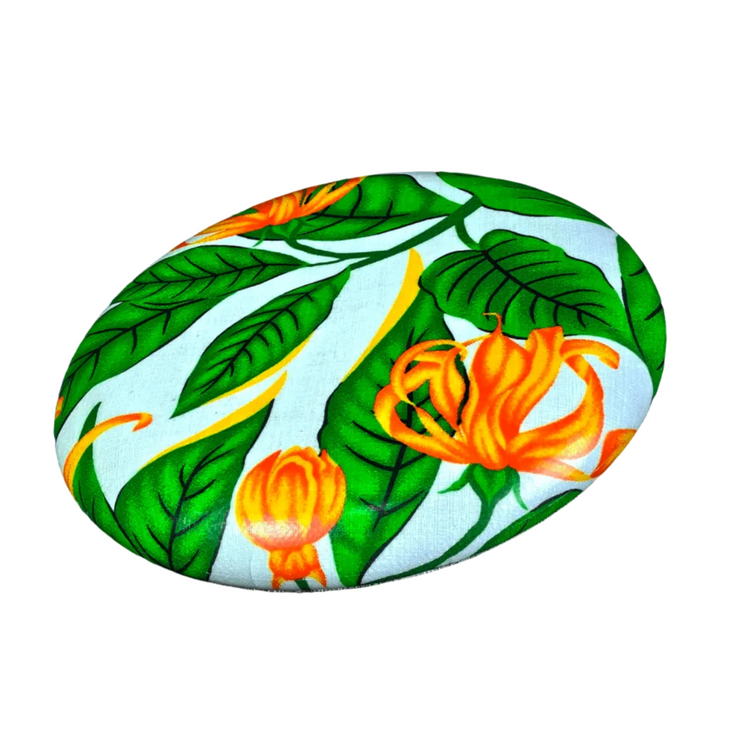 Standalone 230mm flying disc made from recycled Fijian beach waste showing vibrant, one-of-a-kind upcycled colour patterns in floral 3.