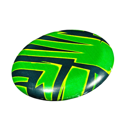 Standalone 230mm flying disc made from recycled Fijian beach waste showing vibrant, one-of-a-kind upcycled colour patterns in palm frond.