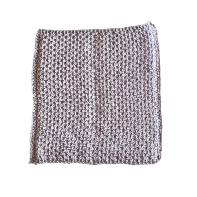 Mauve handmade knitted dishcloth made from absorbent recycled cotton for kitchen and bathroom use.