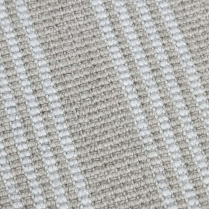 Close-up texture detail of the natural and white stripe woven yarn on a Zebra Home Franklin washable floor rug.