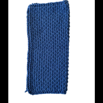 Ocean blue handmade knitted dishcloth made from absorbent recycled cotton, folded in half, for kitchen and bathroom use on a white background.