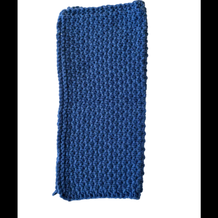 Ocean blue handmade knitted dishcloth made from absorbent recycled cotton, folded in half, for kitchen and bathroom use on a white background.