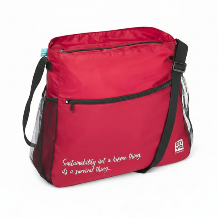 Single Onya packable crossbody side messenger bag showing an adjustable shoulder strap and spacious front compartment panel on a clean white background, available in Australia. Red quote variant shown.