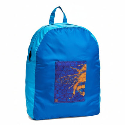 Onya foldable reusable backpack with padded shoulder straps standing with compact integrated keyring storage pouch on a clean white background, available in Australia in bee hive.