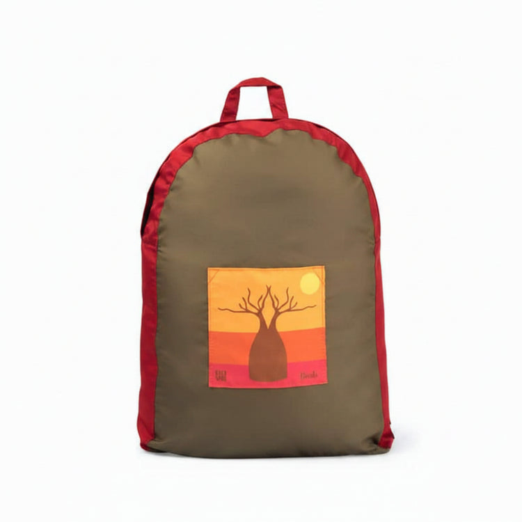 Onya foldable reusable backpack with padded shoulder straps standing with compact integrated keyring storage pouch on a clean white background, available in Australiai in boab.