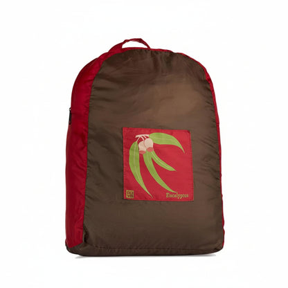 Onya foldable reusable backpack with padded shoulder straps standing with compact integrated keyring storage pouch on a clean white background, available in Australia in eucalyptus variant.