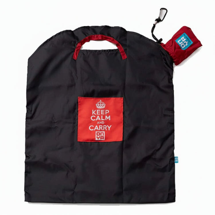 Onya reusable shopping bag with built in shoulder strap and checkout caddy loops next to its attached compact pouch on a clean white background, available in Australia in black keep calm large variant.