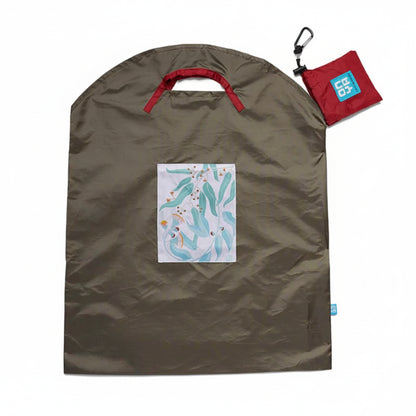 Onya reusable shopping bag with built in shoulder strap and checkout caddy loops next to its attached compact pouch on a clean white background, available in Australia in olive light leaves large variant.