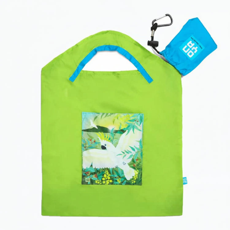 Onya reusable shopping bag with built in shoulder strap and checkout caddy loops next to its attached compact pouch on a clean white background, available in Australia in apple cockatoo small variant.