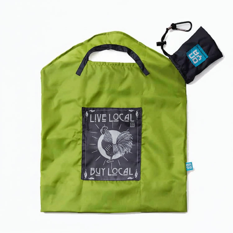 Onya reusable shopping bag with built in shoulder strap and checkout caddy loops next to its attached compact pouch on a clean white background, available in Australia in apple live local small variant.