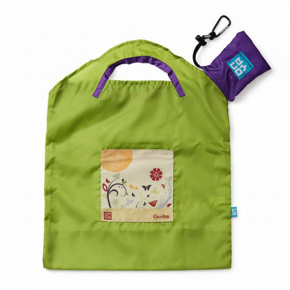 Onya reusable shopping bag with built in shoulder strap and checkout caddy loops next to its attached compact pouch on a clean white background, available in Australia in green apple garden small variant.
