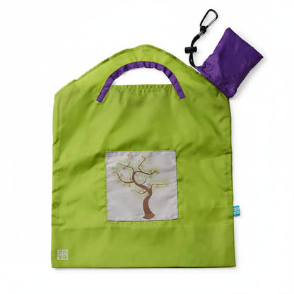 Onya reusable shopping bag with built in shoulder strap and checkout caddy loops next to its attached compact pouch on a clean white background, available in Australia in green apple tree small variant.