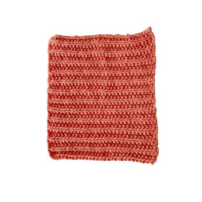 Orange handmade knitted dishcloth made from absorbent recycled cotton for kitchen and bathroom use.