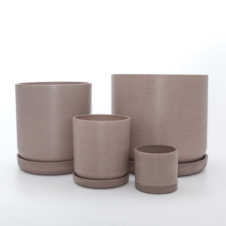 Complete Portland recycled plastic plant pot set of four graduated sizes with matching saucers on a clean white background, available in Australia. Beachwood variant shown.