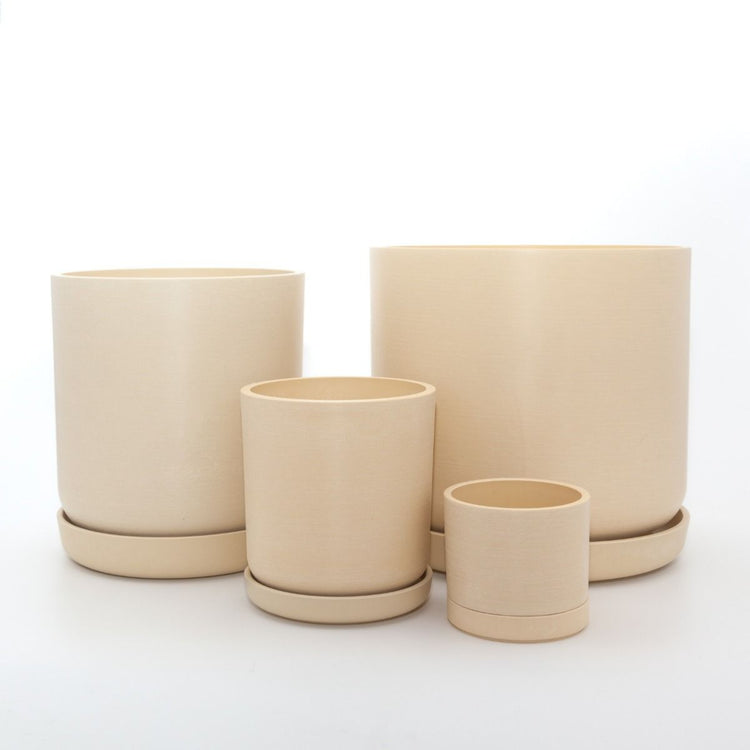Complete Portland recycled plastic plant pot set of four graduated sizes with matching saucers on a clean white background, available in Australia. Tatami sand variant shown.