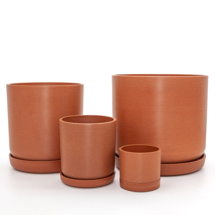 Complete Portland recycled plastic plant pot set of four graduated sizes with matching saucers on a clean white background, available in Australia. Terracotta variant shown.