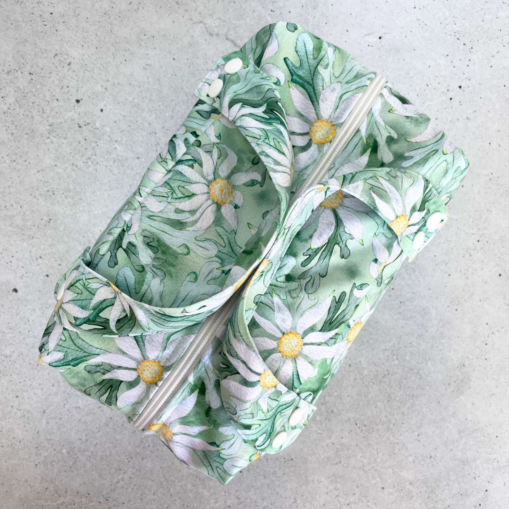 Detailed close up view of the durable woven bag securely zipped on a kitchen benchtop in flannel flower.
