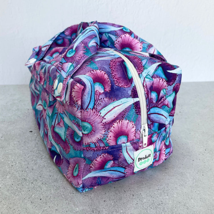 Detailed close up view of the durable woven bag securely zipped on a kitchen benchtop in gum blossom.