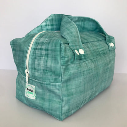 Detailed close up view of the durable woven bag securely zipped on a kitchen benchtop in ocean.