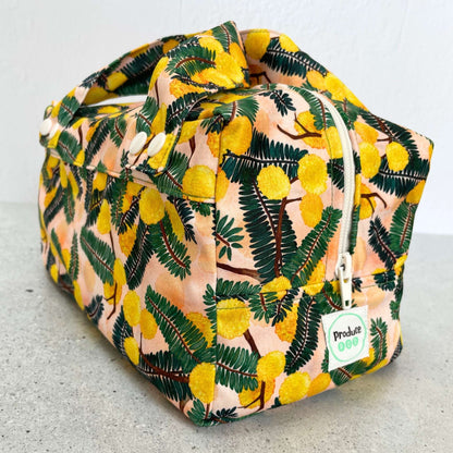 Detailed close up view of the durable woven bag securely zipped on a kitchen benchtop in wattle.